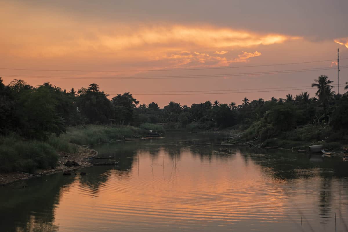 2 Weeks In Cambodia Itinerary: Ultimate Guide 2025 37 watching a sunset over a river in battambang