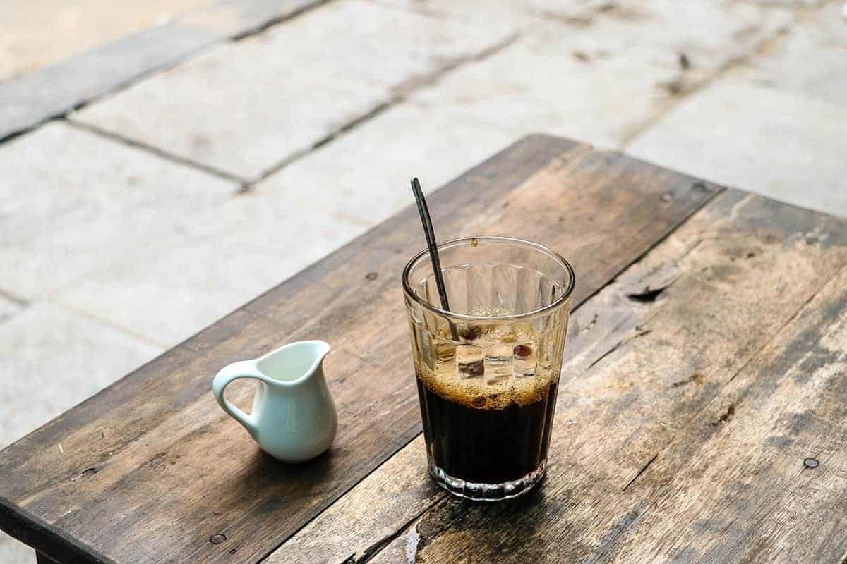 3 Days In Hanoi Itinerary For First Time Visitors 2025 13 having a delicious vietnamese coffee on the streetside in hanoi