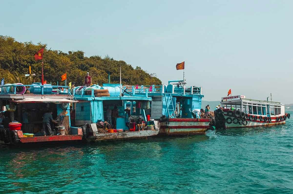 3 Day Nha Trang Itinerary & BEST Travel Tips 27 junk boats linked up in a small island off the coast while backpacking nha trang