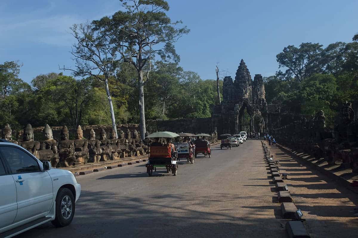Angkor Wat Small Circuit: A Must Do In Siem Reap 21 traffic on the angkor wat small circuit going through one of the gates to angkow thom