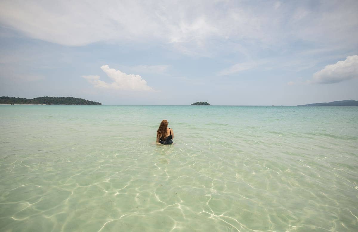 Backpacking Cambodia: BEST Travel Tips For 2025 51 going for a swim on long set beach in koh rong