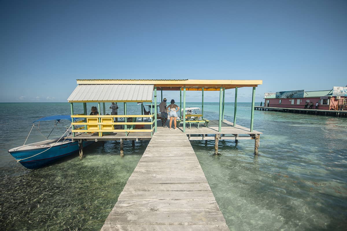 Backpacking Caye Caulker In Belize: Top Travel Tips 4 walking along one of the piers in caye caulker