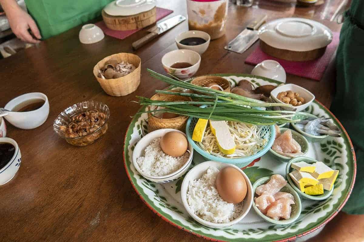 Backpacking Chiang Mai Travel Guide: Costs, Travel Tips and More! 17 taking a cooking school in chiang mai and all the ingredients are lined up