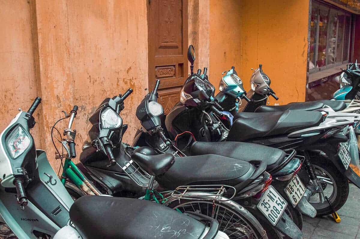 Backpacking Hanoi On A Budget: My Top Travel Tips 35 scooters lined up in the streets of hanoi
