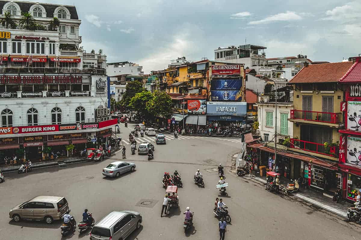 Backpacking Hanoi On A Budget: My Top Travel Tips 5 views from a rooftops cafe while backpacking hanoi
