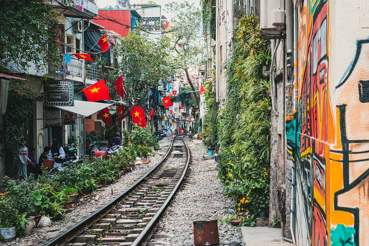 Backpacking Hanoi On A Budget: My Top Travel Tips 31 train street in hanoi with cafes lined up along the sides
