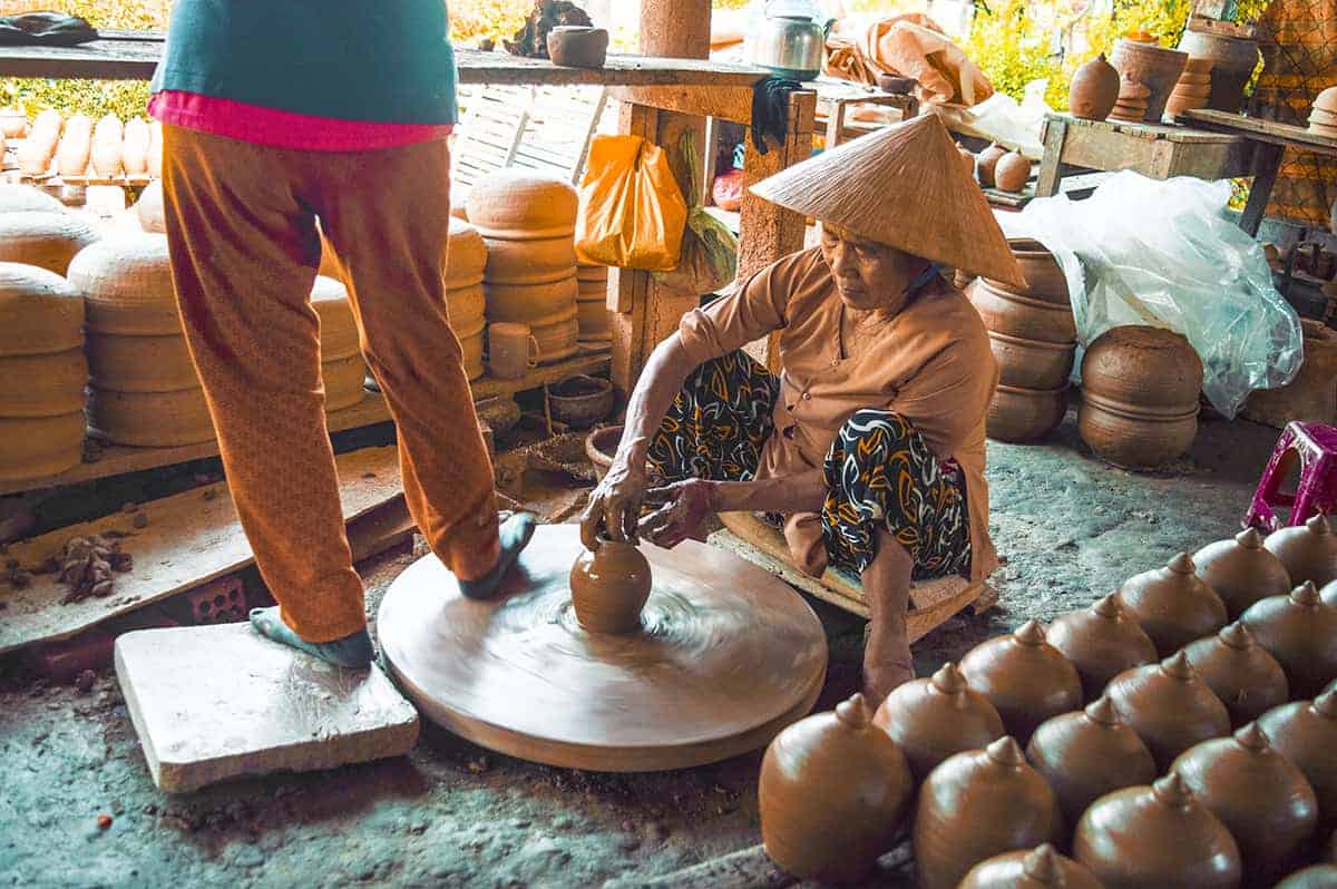 Backpacking Hoi An Itinerary: 3 Days In Hoi An Travel Tips 13 spinning clay at the pottery village on the hoi an itinerary