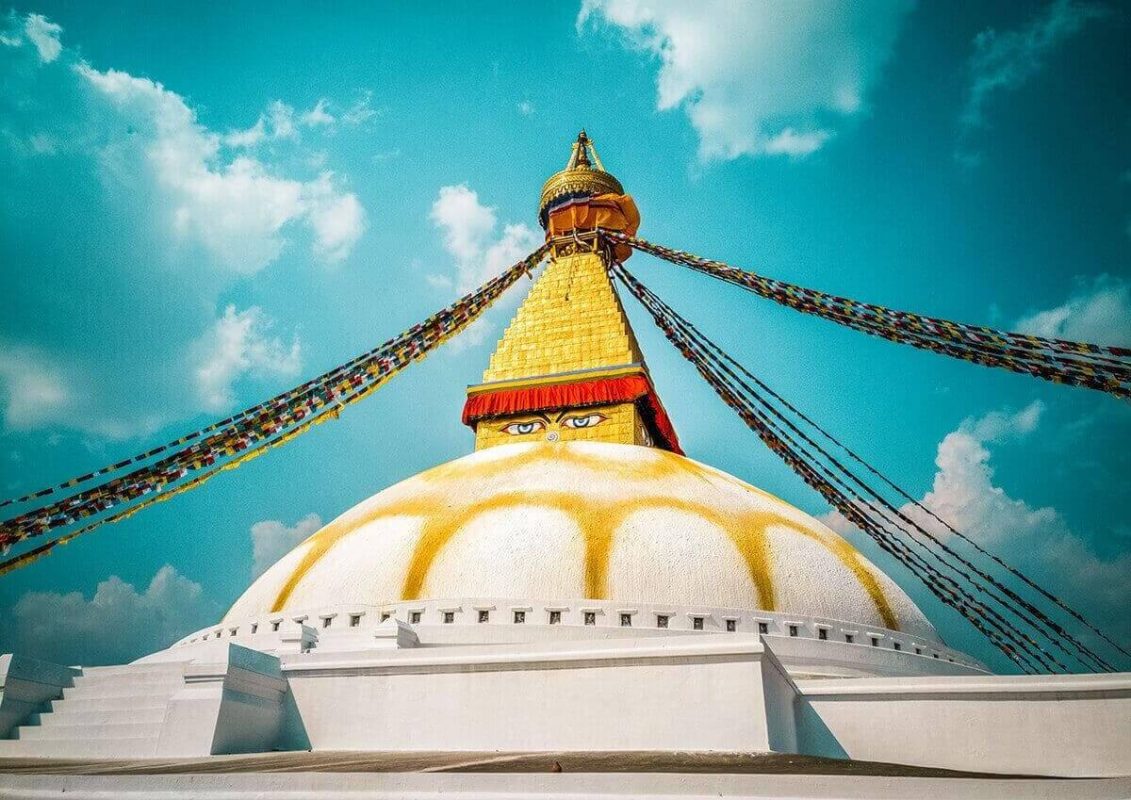 Backpacking Kathmandu: Everything Travelers Need To Know 13 bauddhanath stupa blue sky backpacking kathmandu