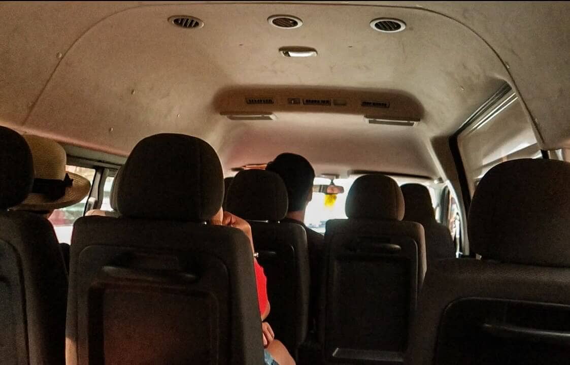 inside a typical minivan in laos