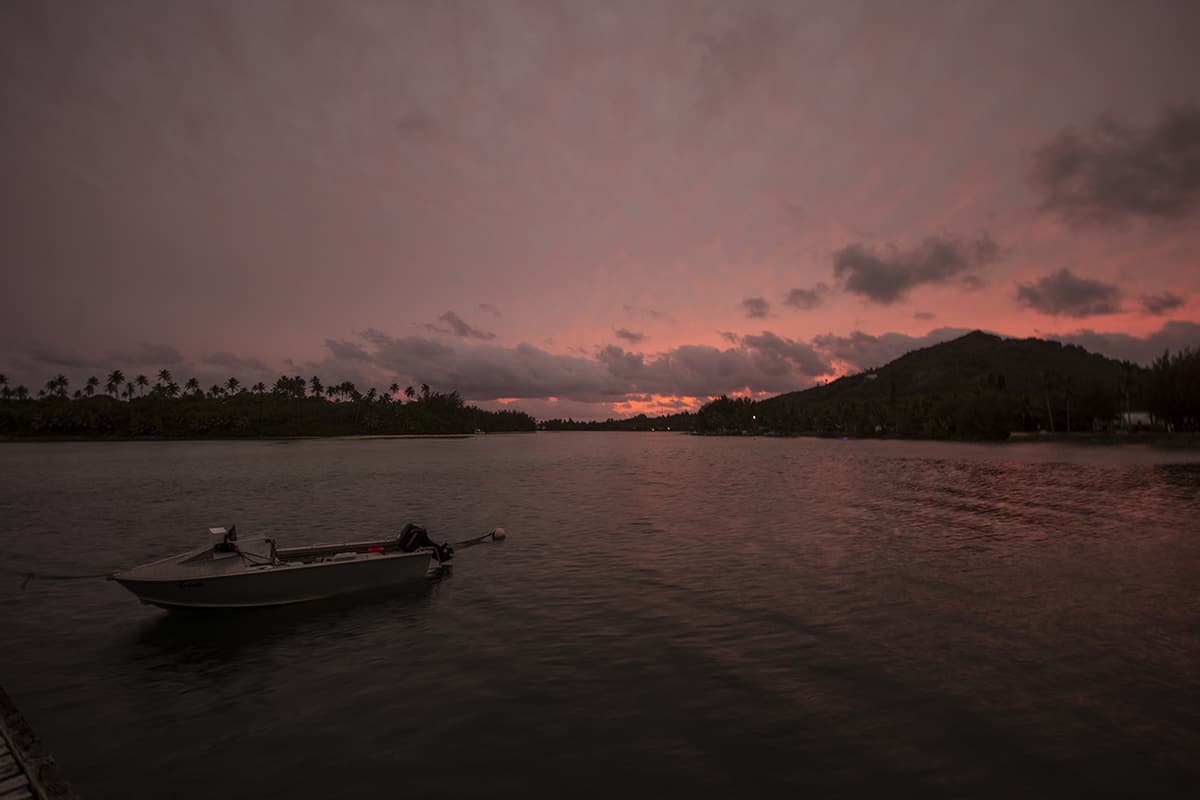 Backpacking Rarotonga On A Budget: Top Travel Tips 21 sunset over muri beach in rarotonga
