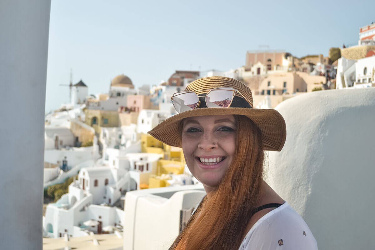Backpacking Santorini On A Budget: All You Need To Know 8 tasha amy in oia backpacking santorini on a budget