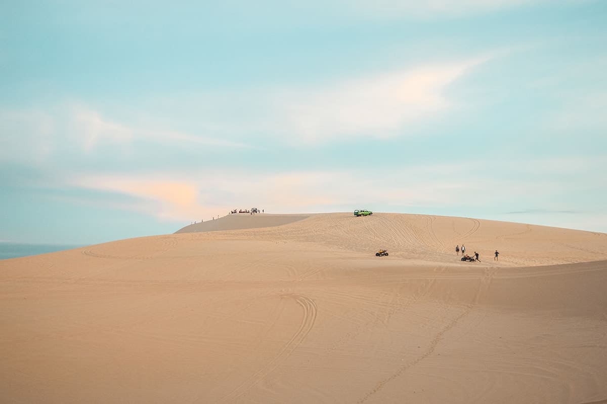 Backpacking Vietnam: Travel Guide & Tips For First Time Visitors 2025 9 exploring the impressive white sand dunes in mui ne while backpacking vietnam