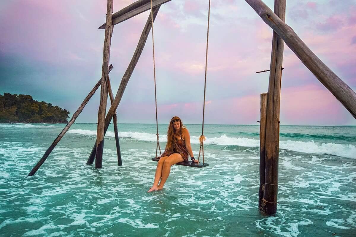 First Time In Southeast Asia? Group Tour VS Solo Travel 15 swing over water during storm at koh rong