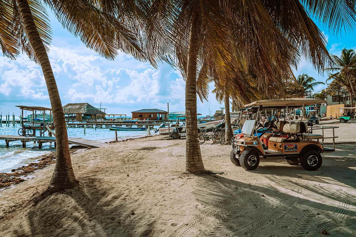 Belize City To San Ignacio: CHEAPEST Ways To Travel 11 hanging out on the waterfront with the gold buggys lined up in san pedro ambergris caye