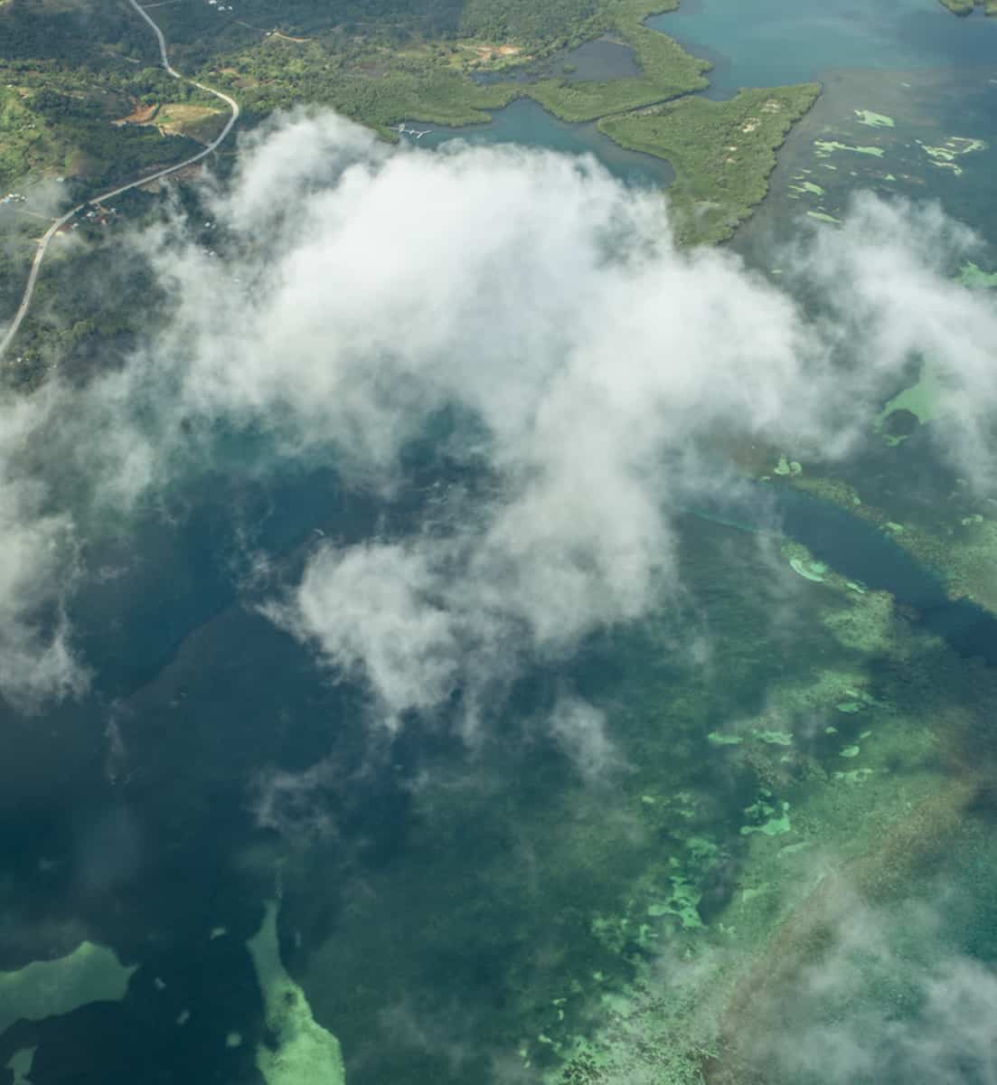 The 9 BEST Beaches In Roatan Worth Visiting 2025 7 flying over roatan with the incredible reef system and beaches below