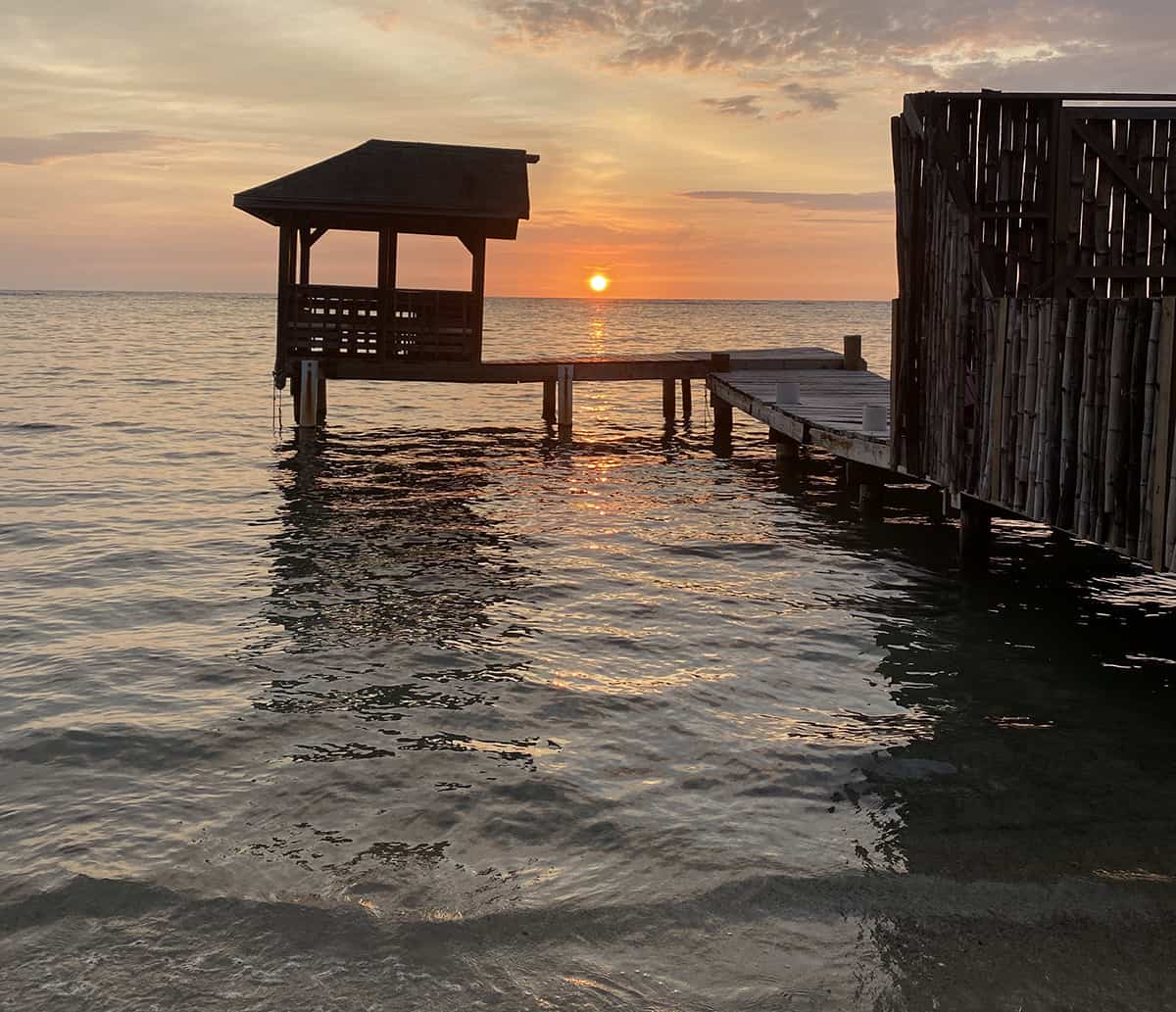 The 9 BEST Beaches In Roatan Worth Visiting 2025 14 watching sunset in west end beach roatan