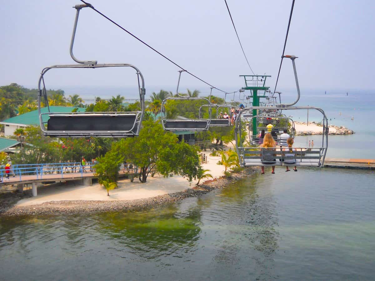 The 9 BEST Beaches In Roatan Worth Visiting 2025 15 taking the chair lift over to mahogany bay in roatan