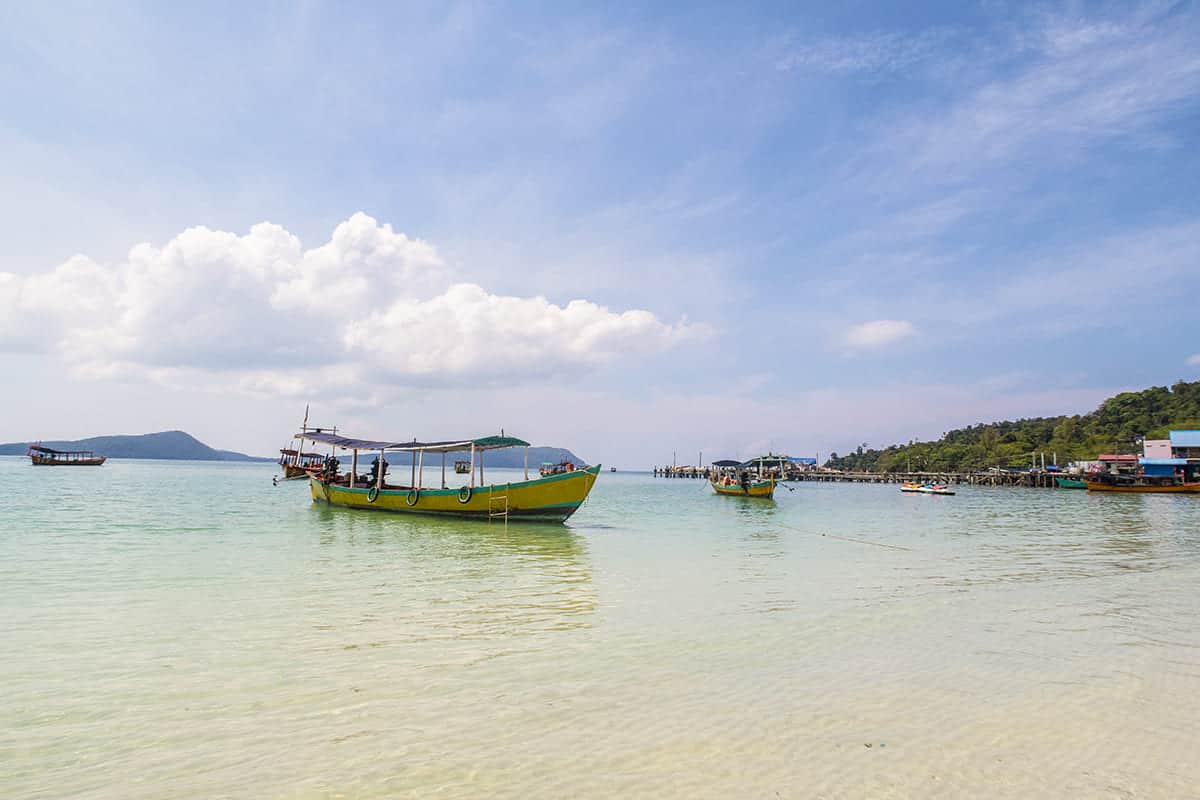 The 9 Best Beaches On Koh Rong Worth Visiting (2025) 9 local boats lined up on the waters edge at koh touch beach on koh rong