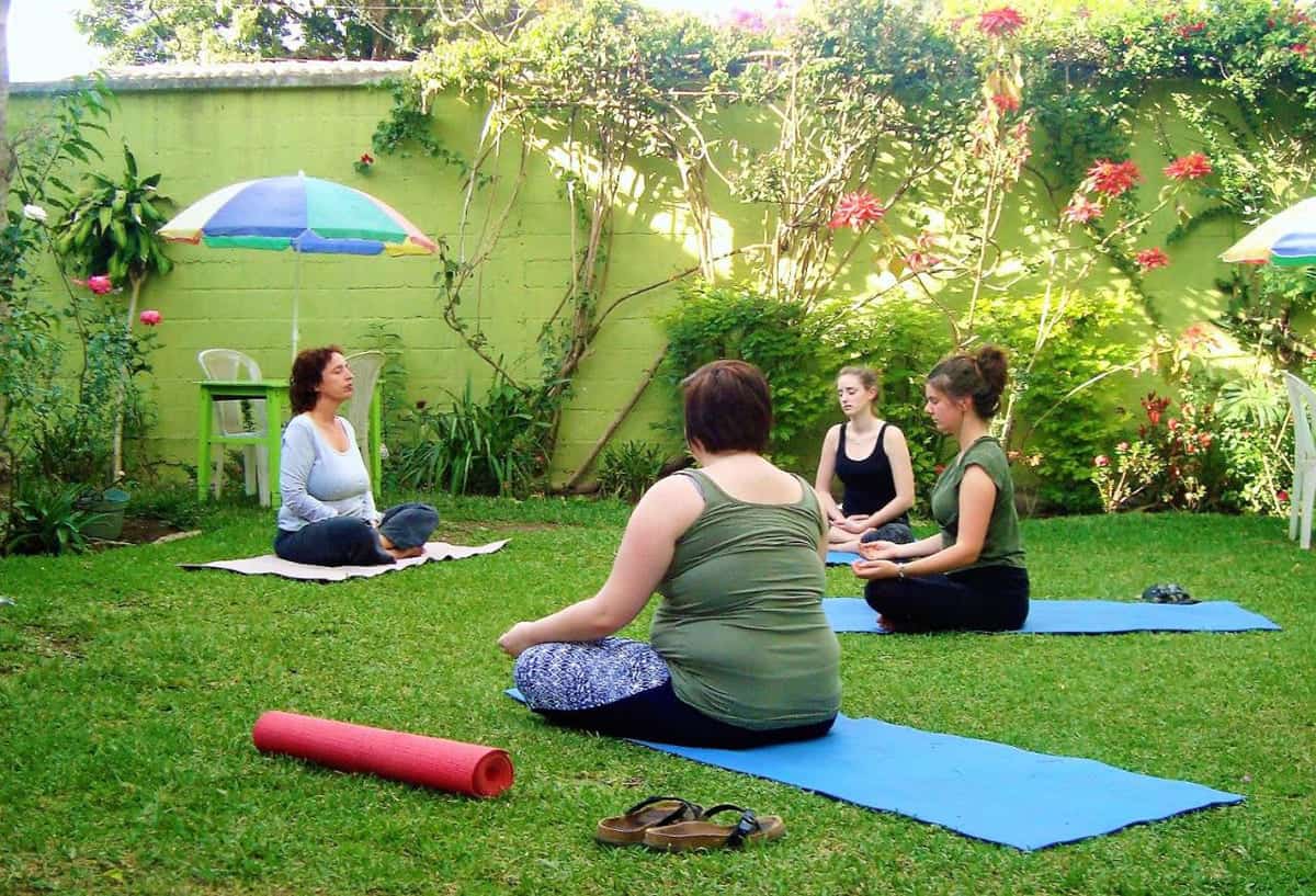 Best Hostels In Antigua, Guatemala: Best Stays In 2025 42 doing group yoga at casa gitana hostel and travelers home in antigua guatemala