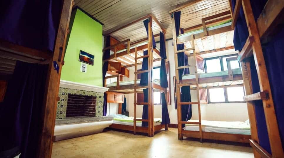 Best Hostels In Antigua, Guatemala: Best Stays In 2025 30 bunk beds stacked 3 high at tropicana hostel in antigua guatemala