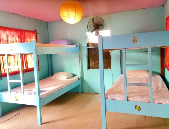 Hostels In Caye Caulker: BEST Stays For Backpackers 10 a fan cooled room at tropical oasis hostel in caye caulker