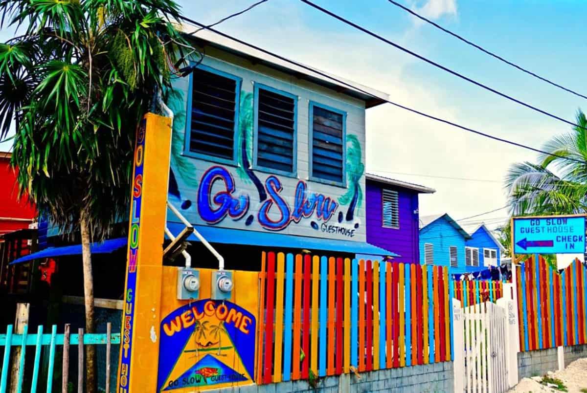 Hostels In Caye Caulker: BEST Stays For Backpackers 5 the colorful building of go slow hostel, one of the best hostels in caye caulker