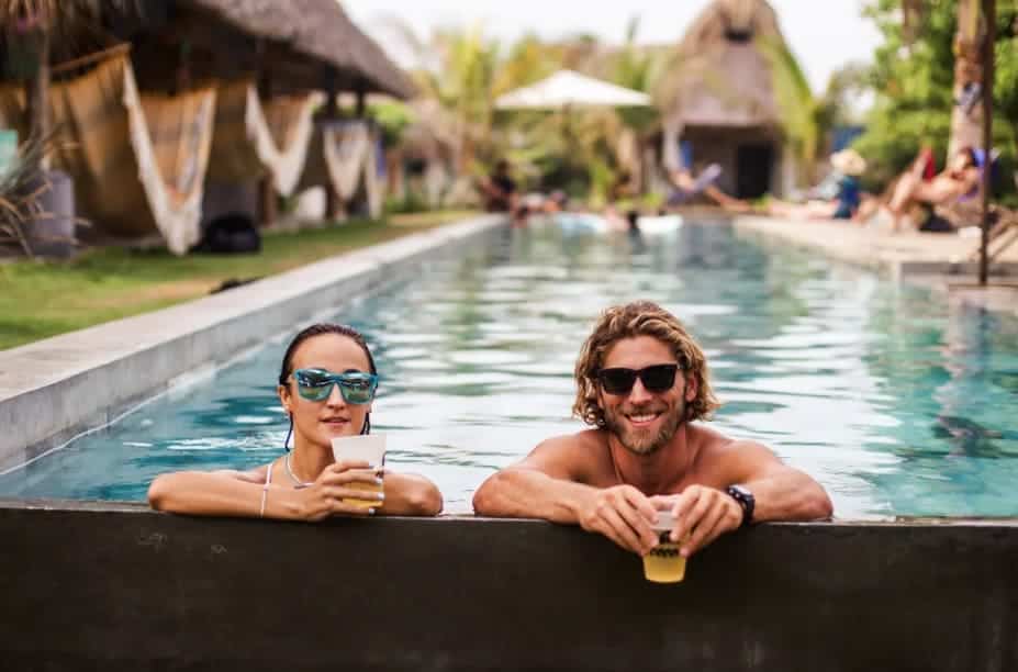 Best Hostels In El Paredon: 8 Hostels For The Perfect Stay 2025 13 having a cold beer at the pool at cocori lodge in el paredon