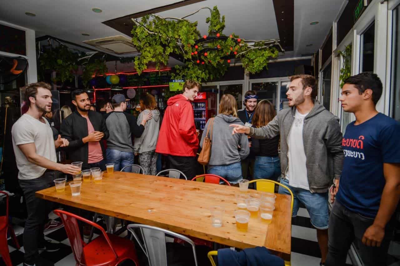 The Best Hostels In Hanoi: 9 Top Hostels Worth Booking 10 playing a game of beer pong at hanoi central backpackers hostel