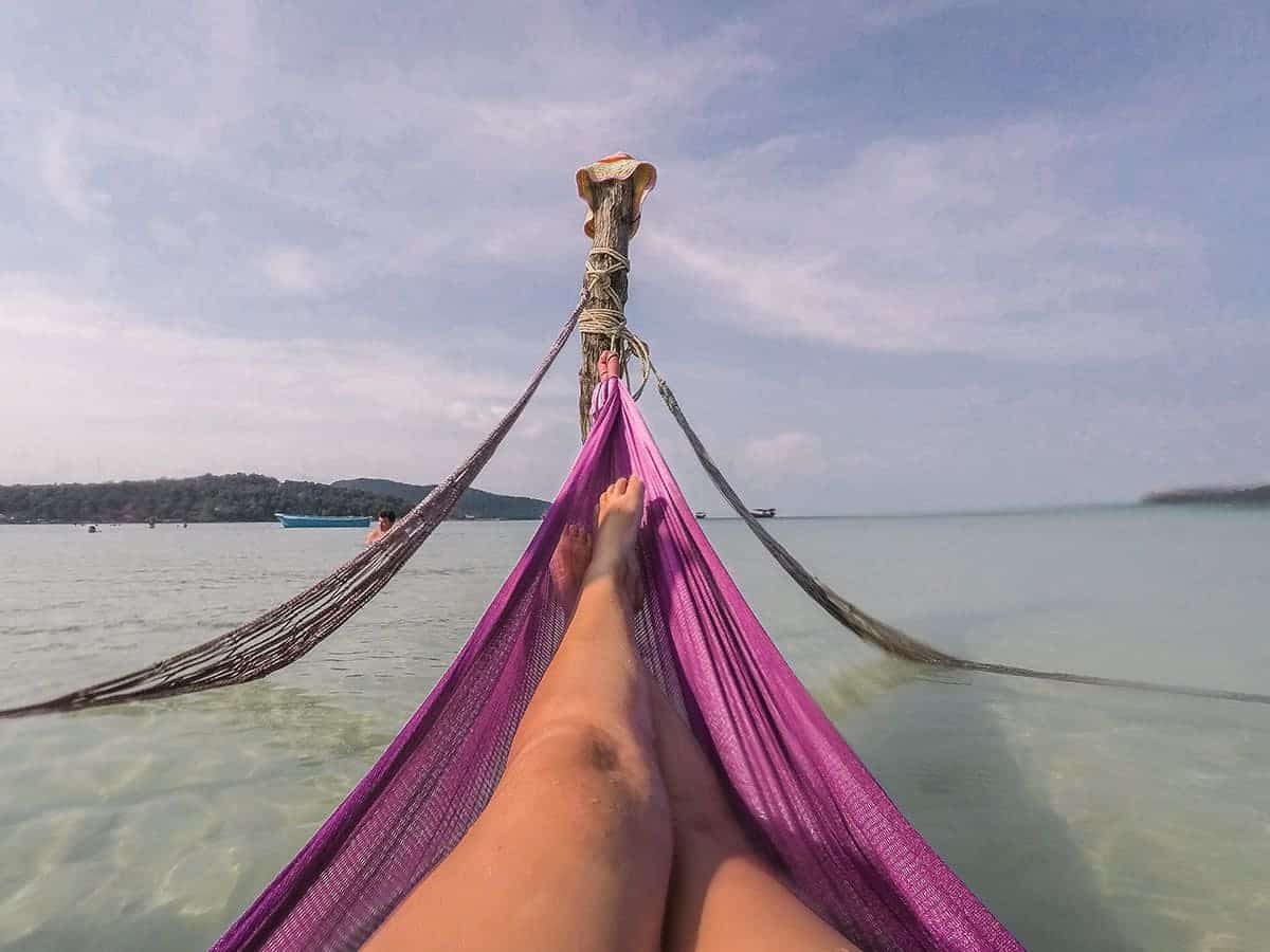 Best Hostels On Koh Rong Samloem & Koh Rong: Top Dorms In Paradise (2025) 18 enjoying the hammocks in the ocean on koh rong samloem