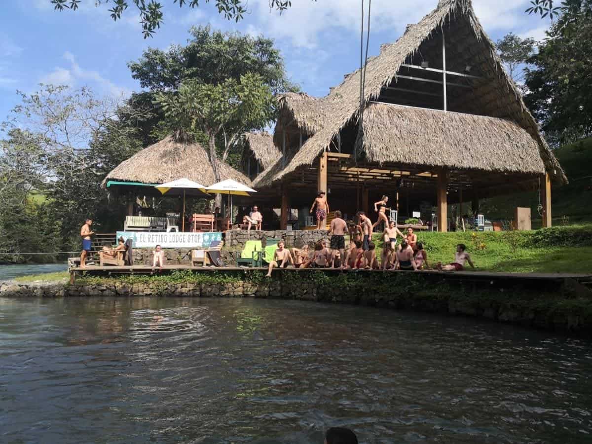 Best Hostels In Semuc Champey: For Solo Travelers, Females, Couples & More 17 hanging riverside with fellow travelers at el retiro lanquin