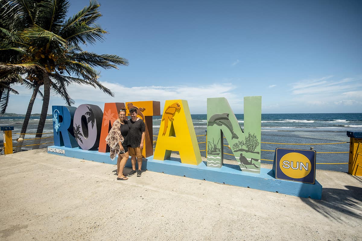 20 BEST Things To Do In Roatan: Discover Paradise (2025) 12 getting an obligatory photo at the famous roatan sign