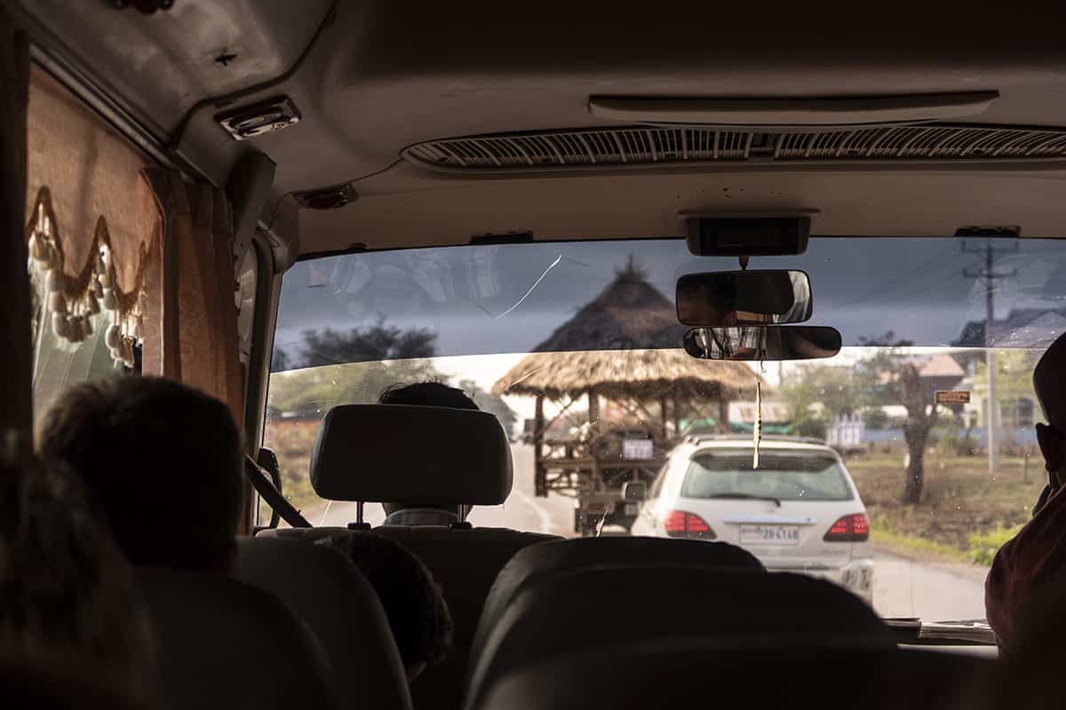Cost To Travel Cambodia: My $29.00 Per Day Travel Budget 10 a structure balancing on the back of a truck in cambodia