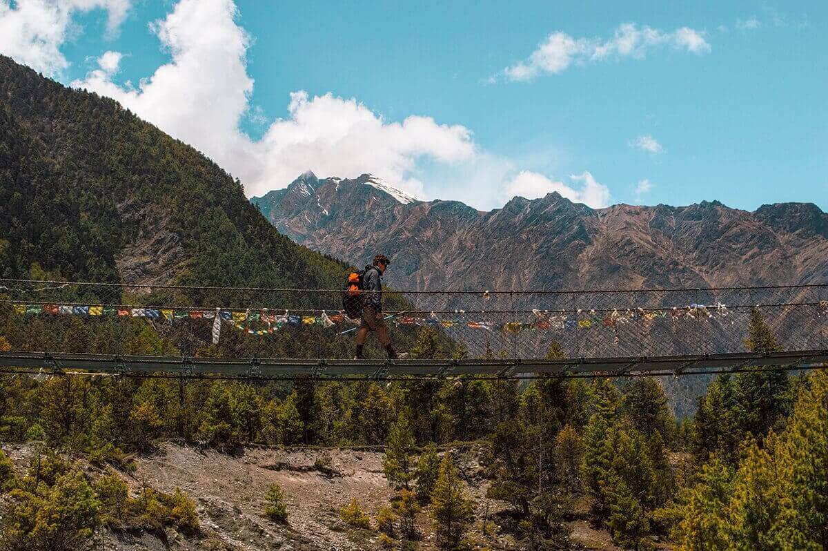 Day 5: Chame To Upper Pisang On The Annapurna Circuit 18 walking over bridge chame to upper pisang annapurna circuit