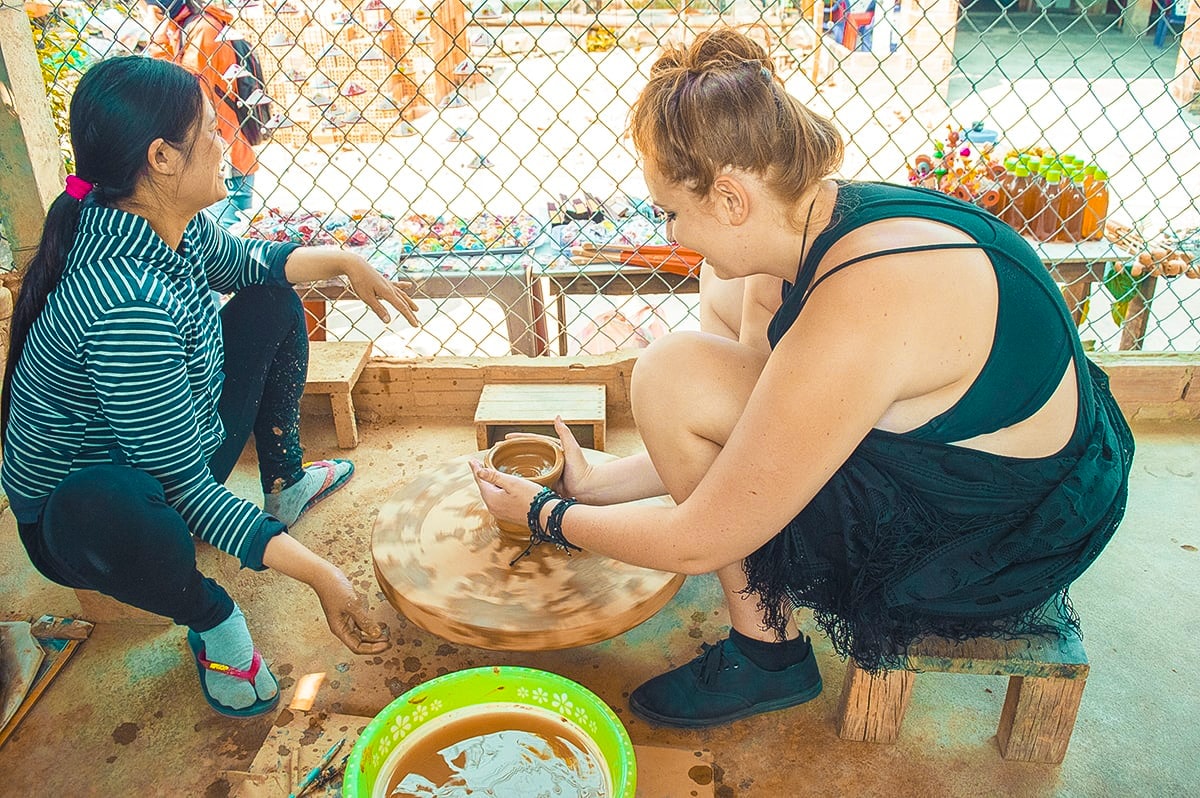 Top Things To Do In Hoi An, Vietnam 5 girl spinning pottery in thanh ha pottery village hoi an