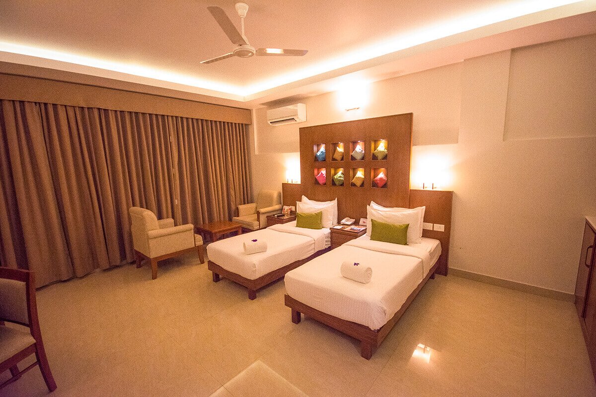 Where To Stay In Kerala? Mindblowing Hotels In Kerala! 14 twin bedroom at the fog hotel munnar