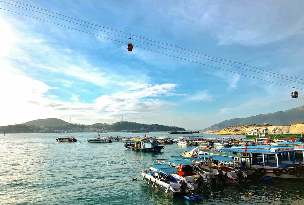 Hoi An To Nha Trang: 5 BEST Options Explained 19 harbor views in nha trang with the cable car to vinpearl overhead