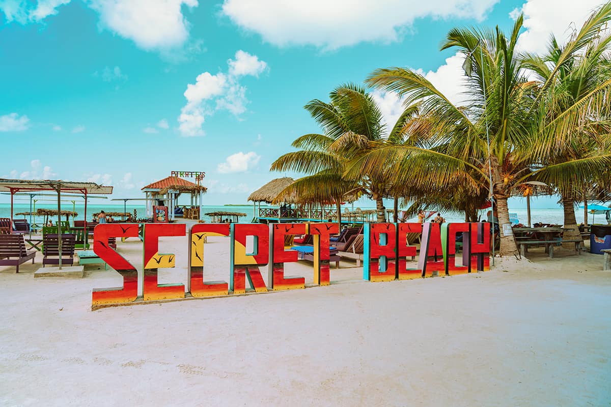 BEST Hostels In Ambergris Caye & Backpacking San Pedro 18 the main signage at secret beach in ambergris caye