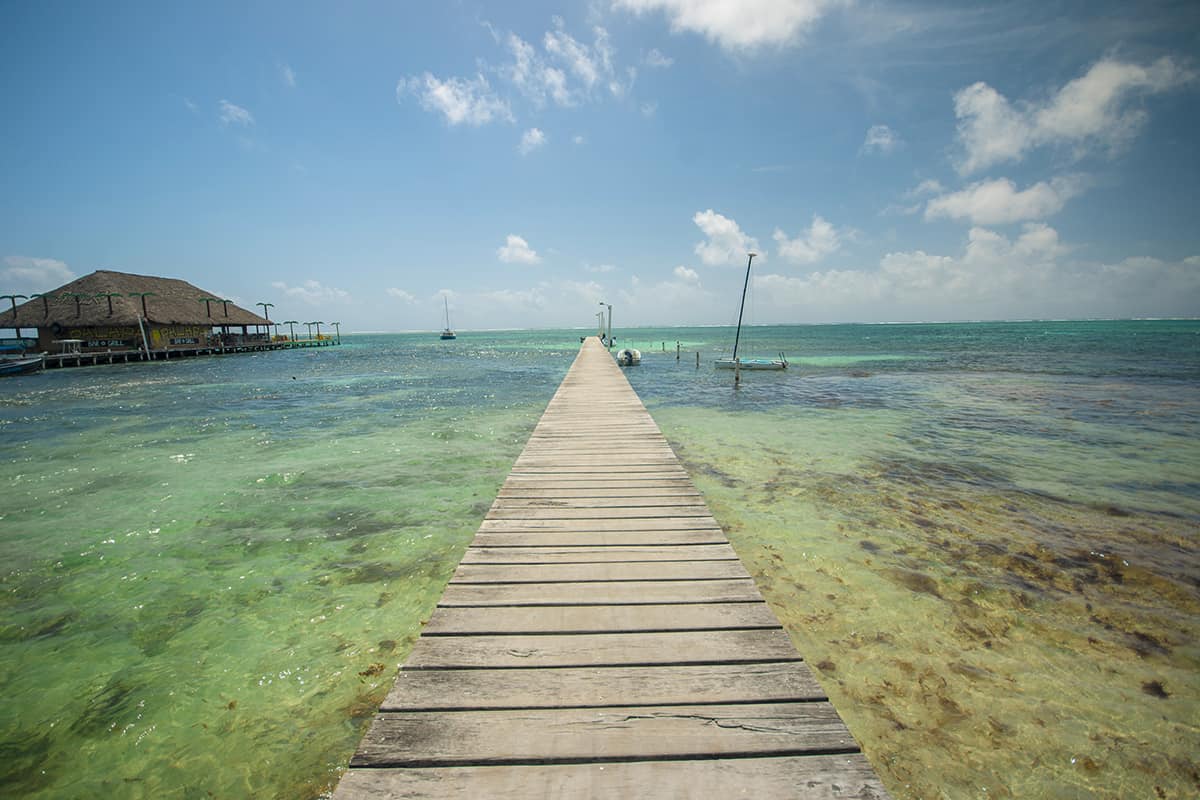 BEST Hostels In Ambergris Caye & Backpacking San Pedro 5 looking out to the belize reef from a pier in front of my hostel in ambergris caye