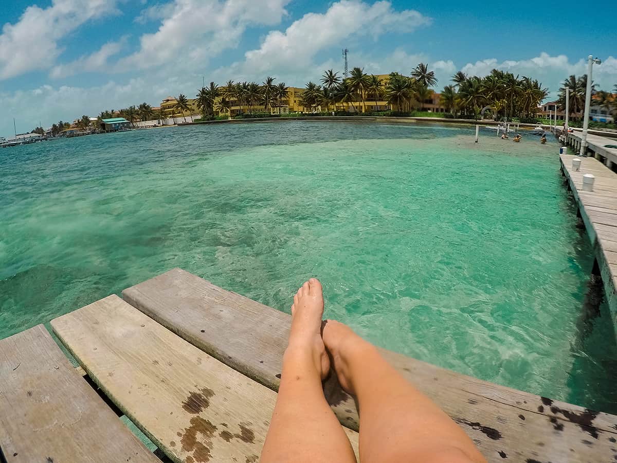 Diving In Ambergris Caye: Is It Worth It & Best Tips 2025 22 enjoying relaxing on one of the piers in san pedro in front of paradise villas