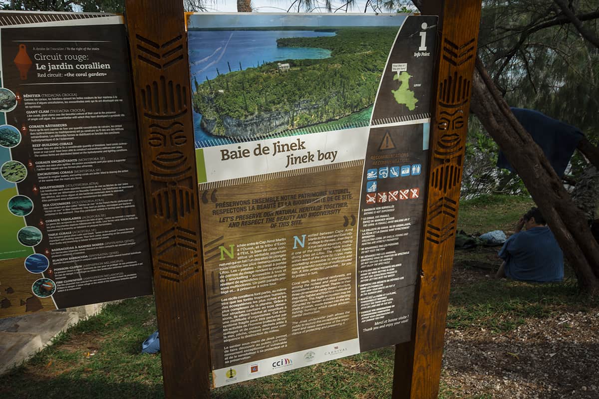 Jinek Bay Snorkeling In Lifou: BEST Snorkeling In New Caledonia? 11 an information board showcasing jinek bay in lifou