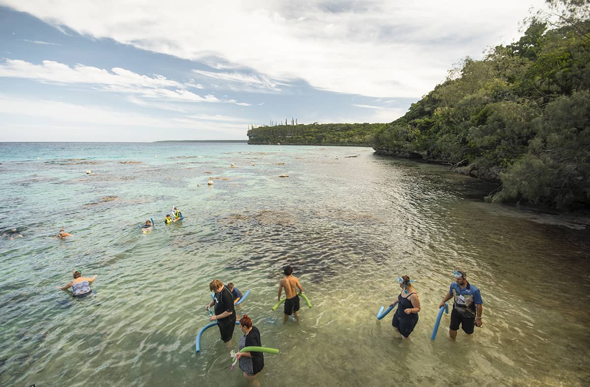 Jinek Bay Snorkeling In Lifou: BEST Snorkeling In New Caledonia? 6 entering the shallow waters of jinek bay