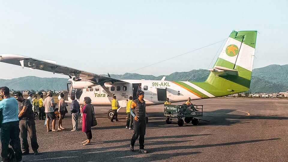 Day 14: Flying Jomson To Pokhara On The Annapurna Circuit 1 unloading plane flying jomsom to pokhara on the annapurna circuit