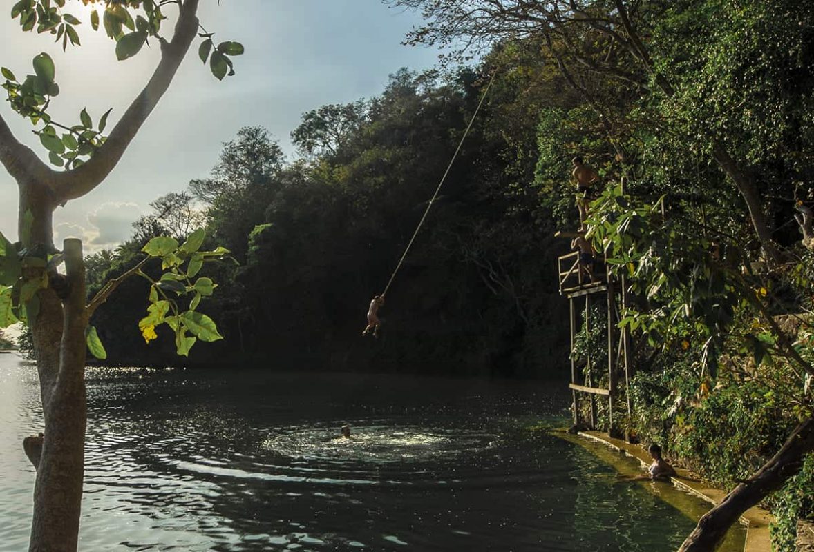 Jorge's Rope Swing In Flores: Backpackers Paradise 51 jumping into the cool water from jorges rope swing in flores