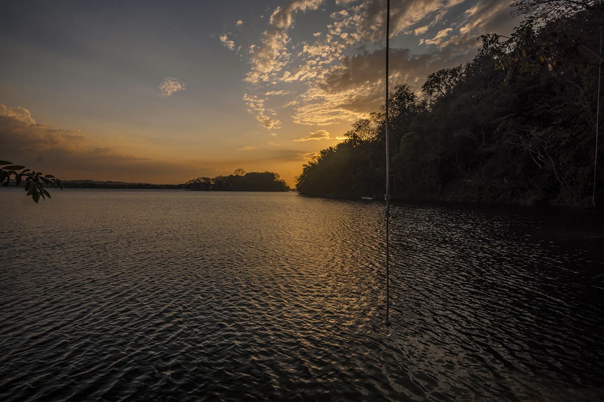 Jorge's Rope Swing In Flores: Backpackers Paradise 16 watching sunset from jorges rope swing when we are the only travelers left