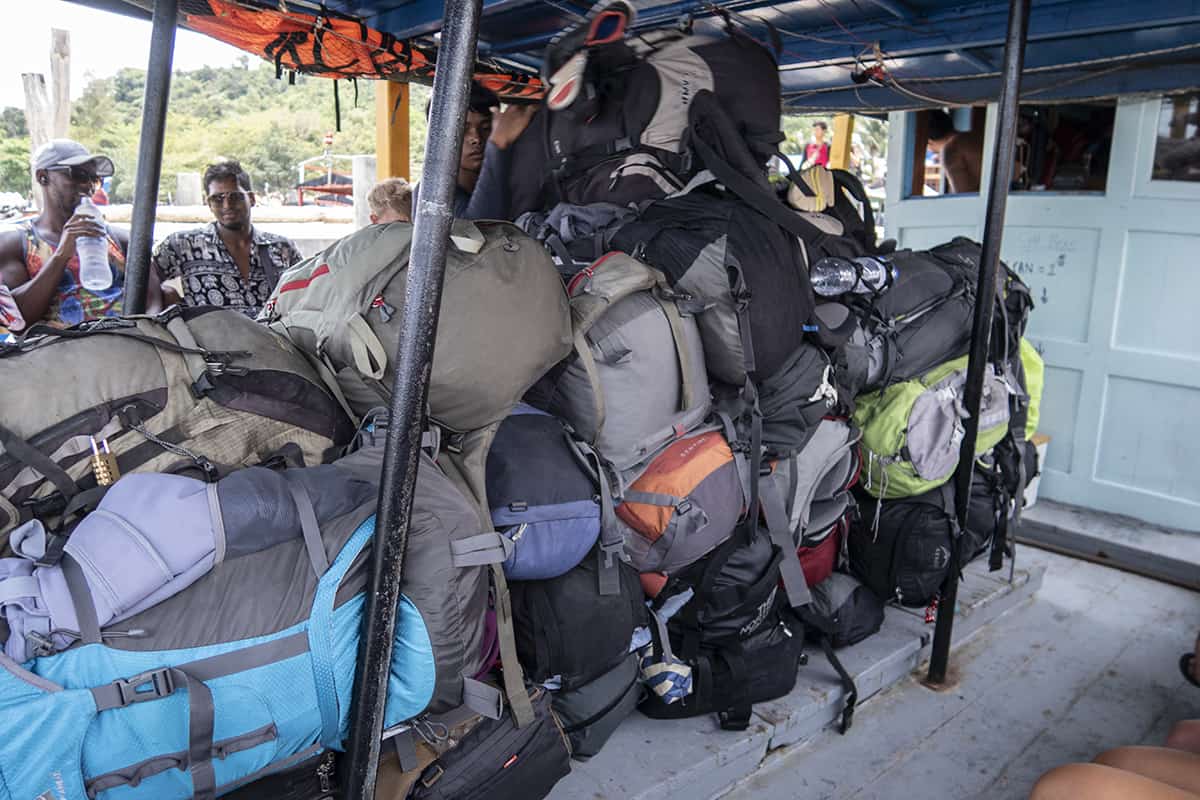 Koh Rong To Koh Rong Samloem: The Best & Easiest Ways To Travel (2025) 4 all the travelers bags stacked up on the supply boat
