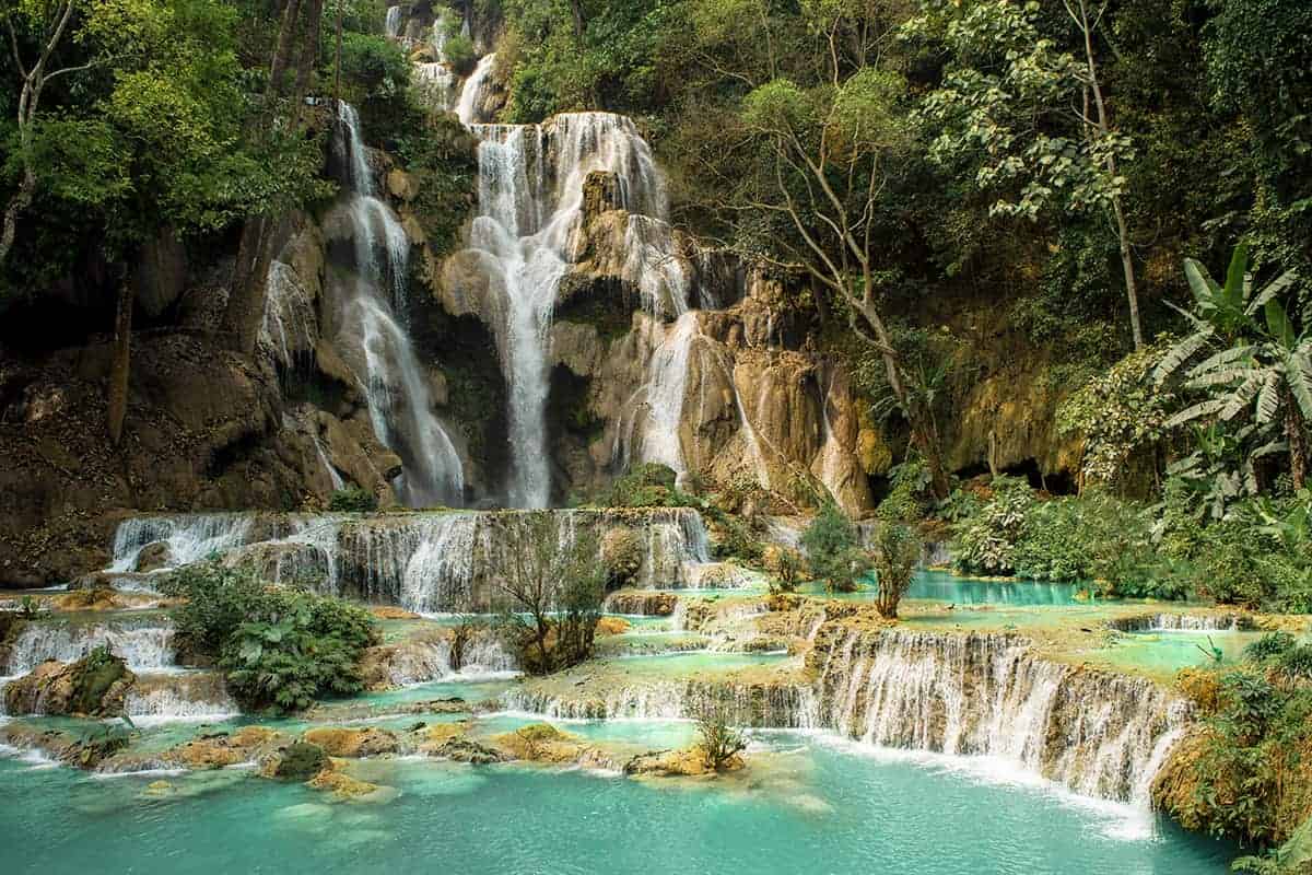 Cost To Travel Laos And My Laos Travel Budget: $30.00 Per Day 16 the view of the main waterfall at kuang si falls from the footbridge