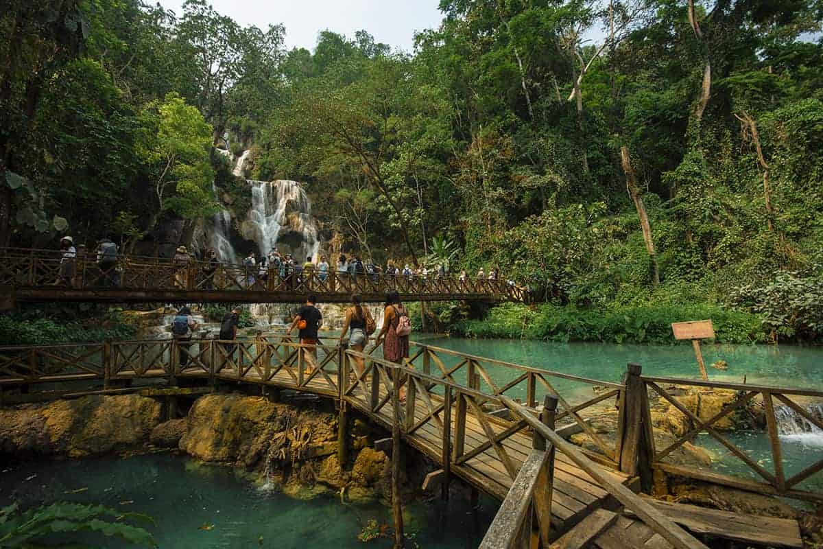 Kuang Si Falls In Luang Prabang: The Ultimate Guide 9 crowds on the footbridge at kuang si falls