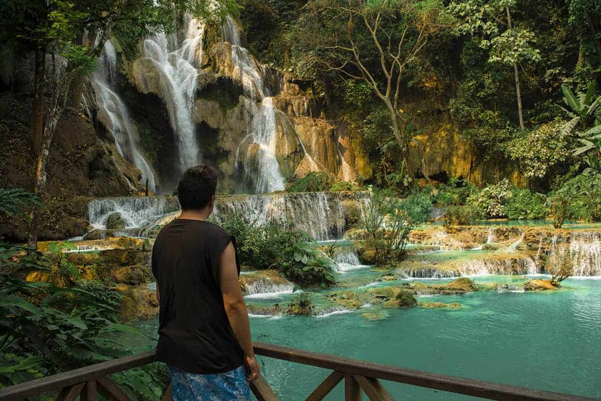 Kuang Si Falls In Luang Prabang: The Ultimate Guide 17 looking at the main waterfall at kuang si falls