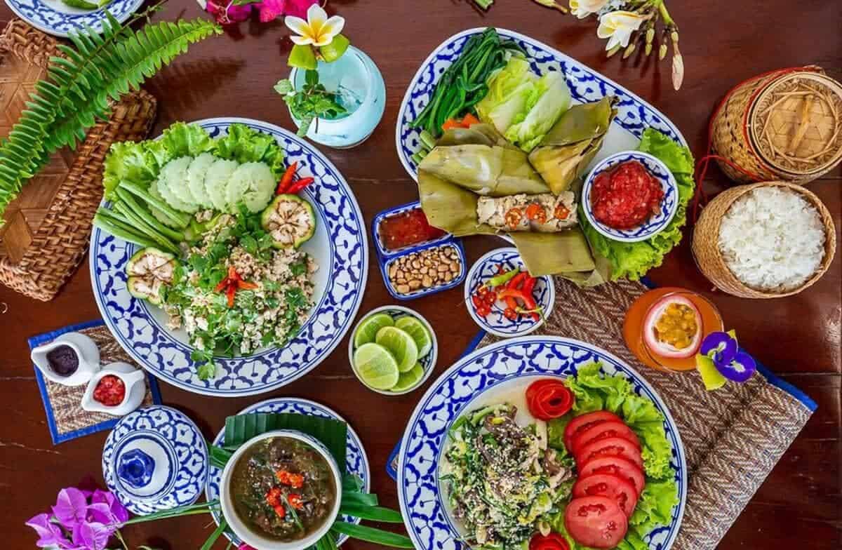 Cost To Travel Laos And My Laos Travel Budget: $30.00 Per Day 7 local foods at a restaurant in vang vieng