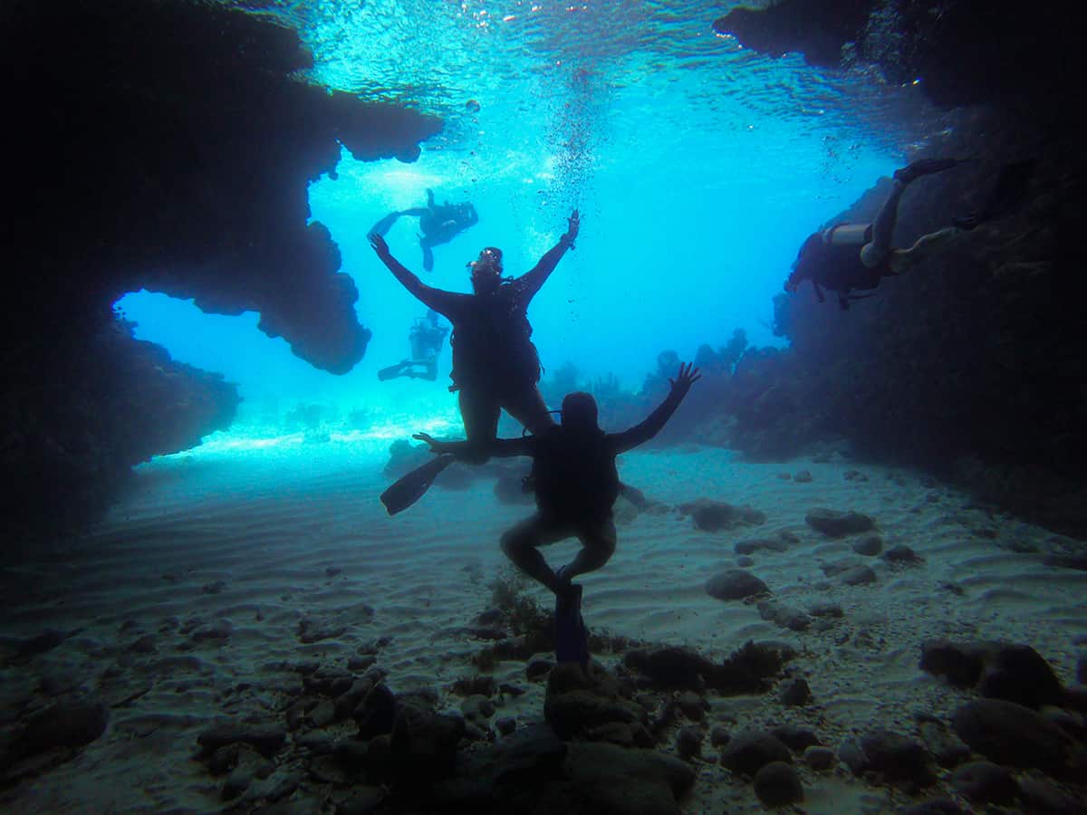 Learn To Dive In Roatan: Scuba Diving Roatan Companies, Prices & What To Expect 8 diving inside our first cave in roatan called blue cave, albeit a small one, it still counts